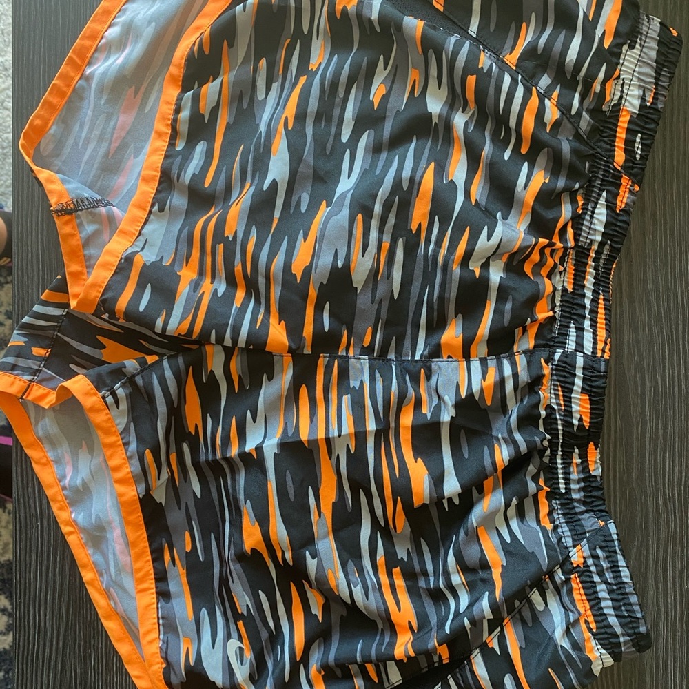 Black grey and orange camo Nike running shorts